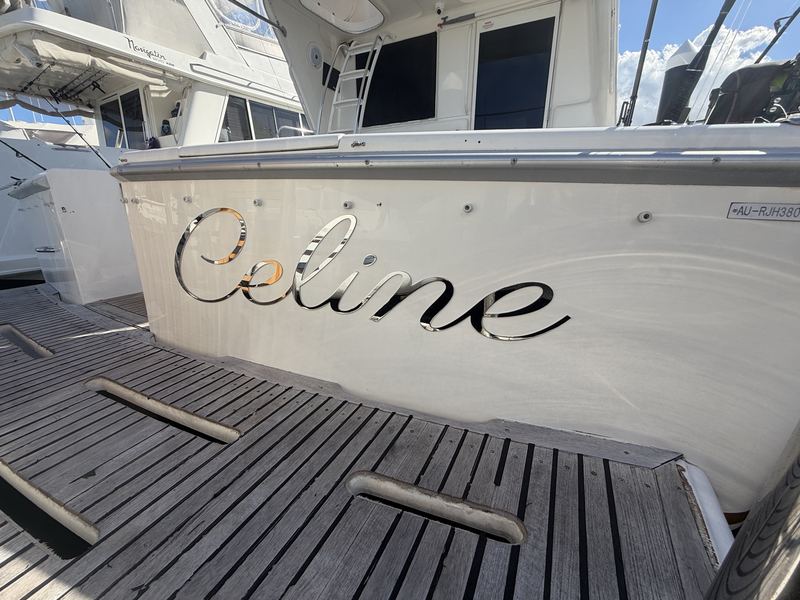 Celine mirror-polished stainless steel script boat name on a transom